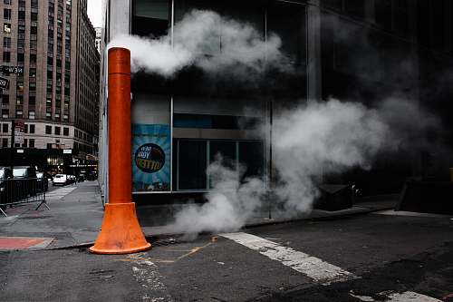 new york orange post near building asphalt